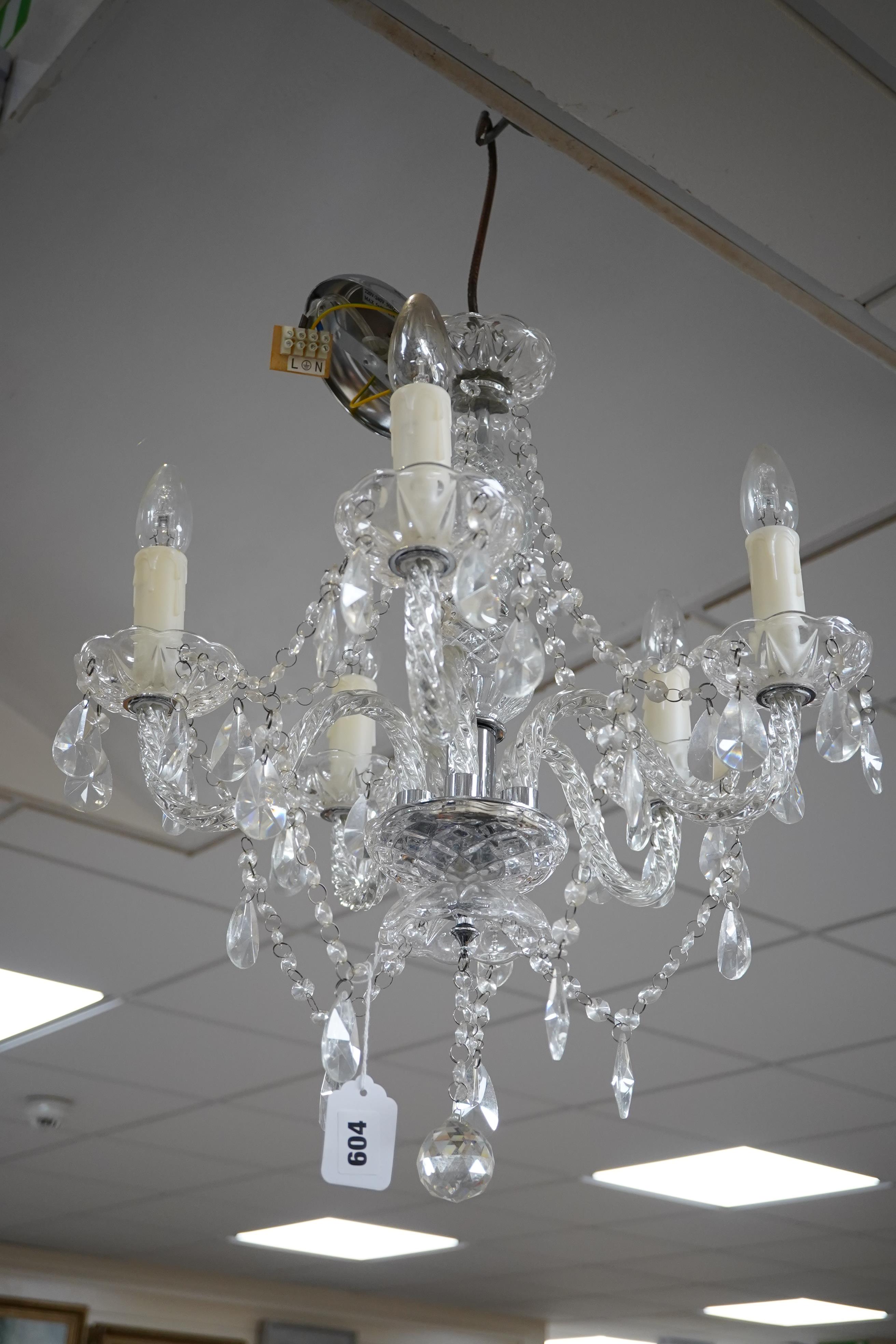 A pair of five branch cut glass chandeliers, approximately 55cm high. Condition - good